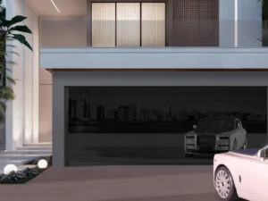 Elegant modern house featuring a black frameless glass garage door that adds a sleek, contemporary curb appeal.